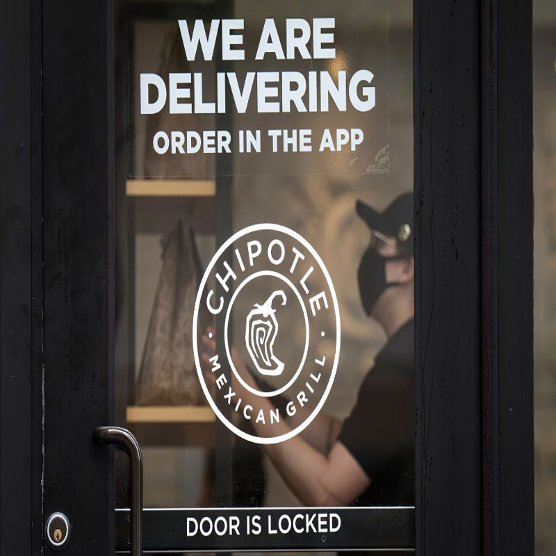 A worker wearing a protective mask puts a food order on a shelf inside a Chipotle Mexican Grill Inc. restaurant in San Francisco, California, U.S., on Monday, July 20, 2020. Chipotle is scheduled to release earnings figures on July 22.