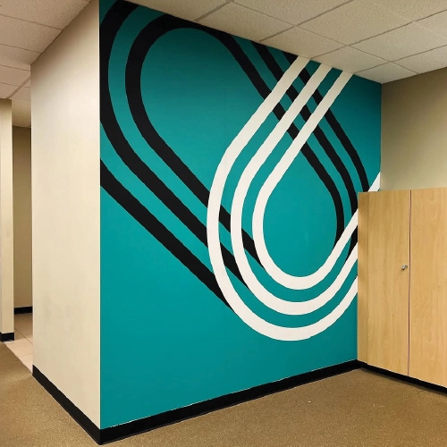 Interior gym wall wrap graphic at 200 Union in Lakewood, Colorado, featuring dynamic and inspiring environmental graphics.