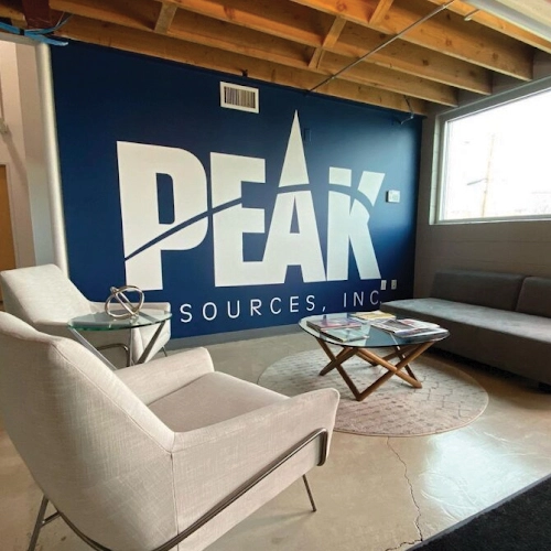 Interior lobby sign for PEAK Resources, a company in Denver, Colorado, featuring a modern and professional design.