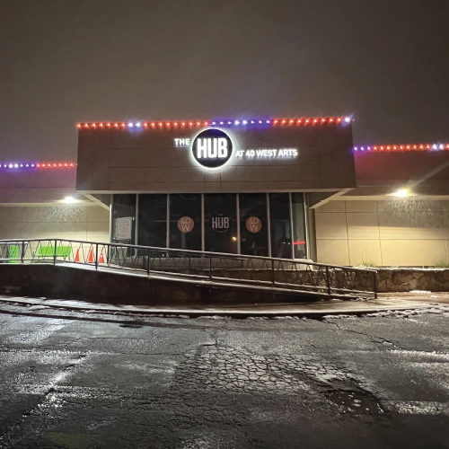 Back-lit channel letter business sign for The HUB at 40 West Arts in Lakewood, Colorado, designed and installed by Banner Signs Denver to enhance visibility and night-time appeal.